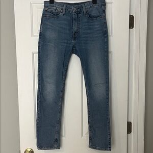 Levi's 550 Slim Fit men's jeans in a medium wash blue